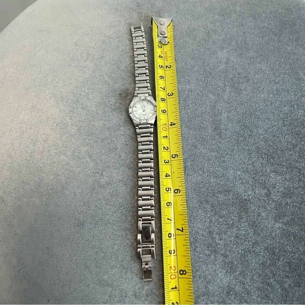 Quartz silver-tone stainless steel crystal rhinestone round face watch